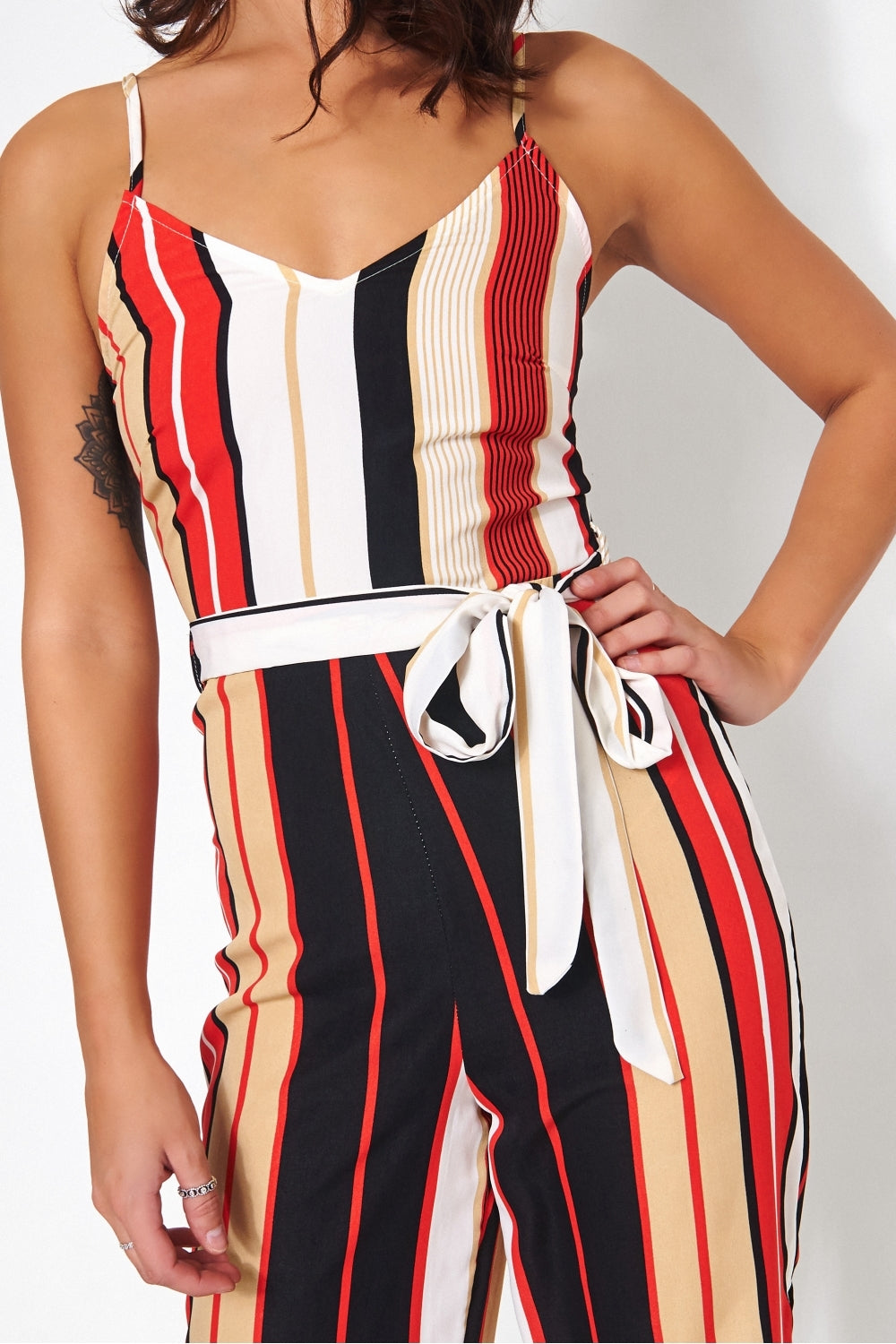 Black jumpsuit with red stripe online